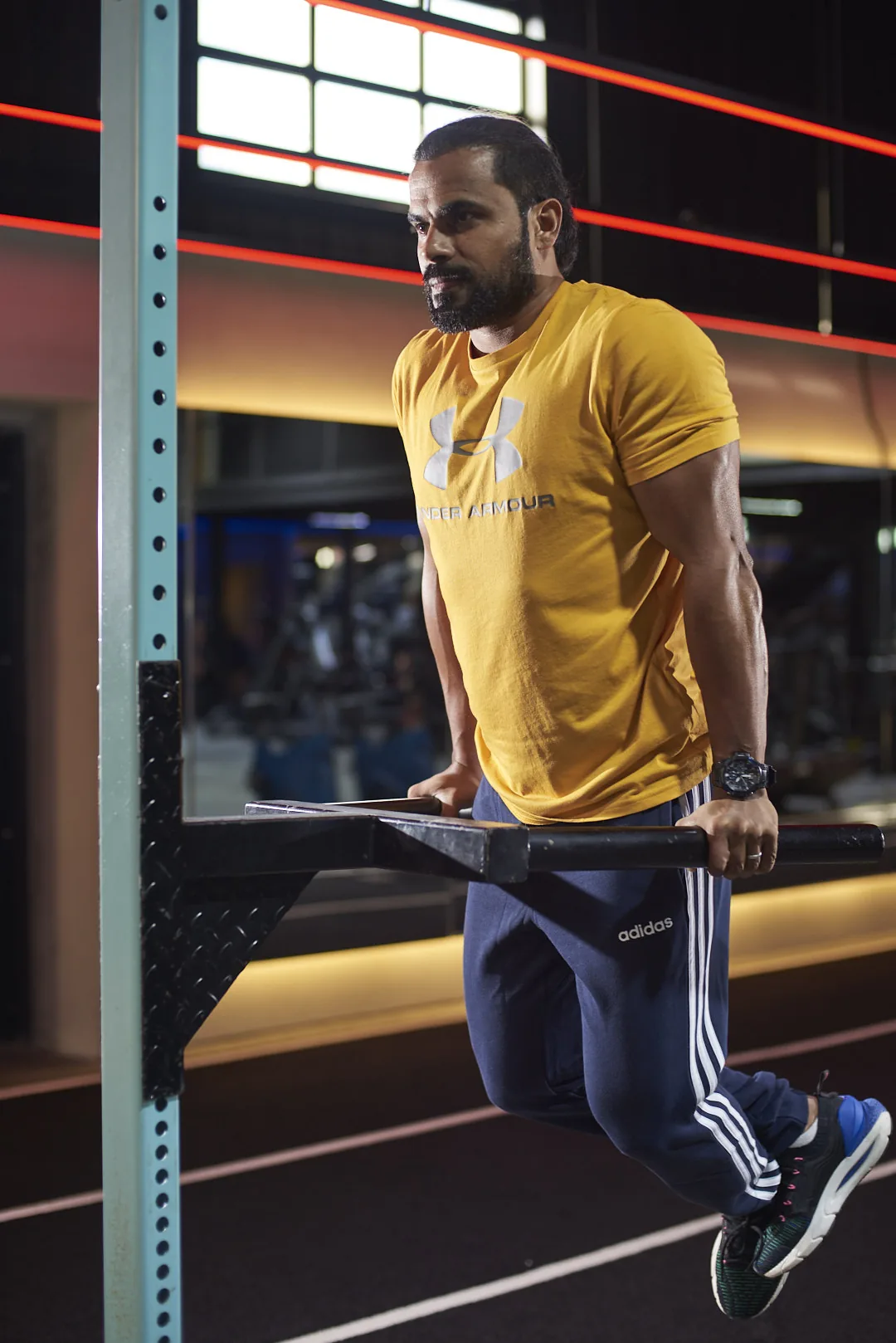 Mansoor Ahamad Ali performing parallel-bar dips — WYBE founder and practitioner